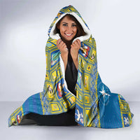 Blue hooded blanket with star-and-angel graphic, hood up and sherpa lining visible