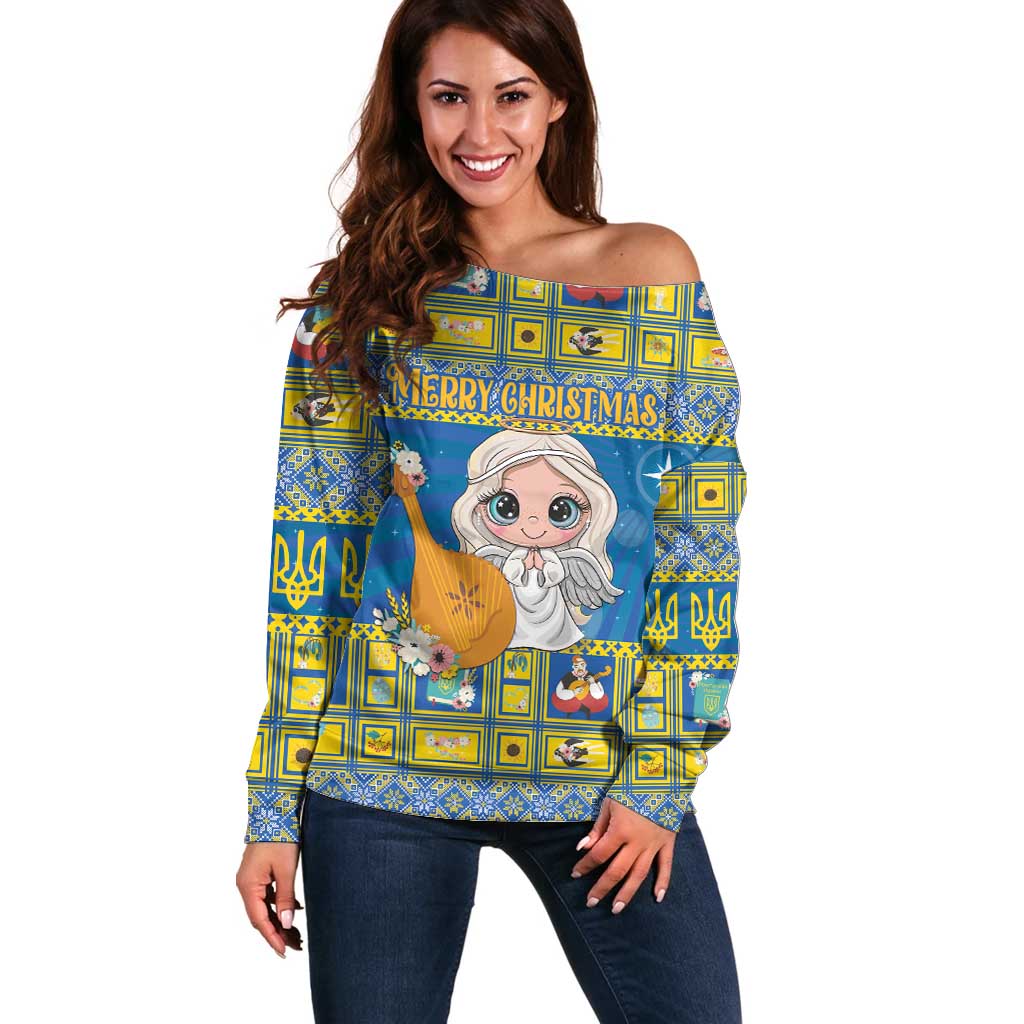 Women’s blue off-shoulder Christmas sweater with angel graphic and festive banner
