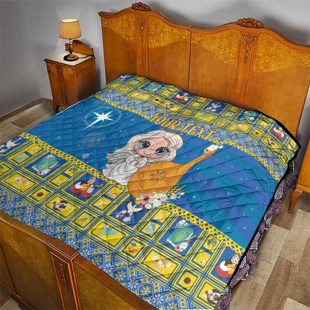 Personalized blue quilt on bed, angel holding star wand and yellow patterned border