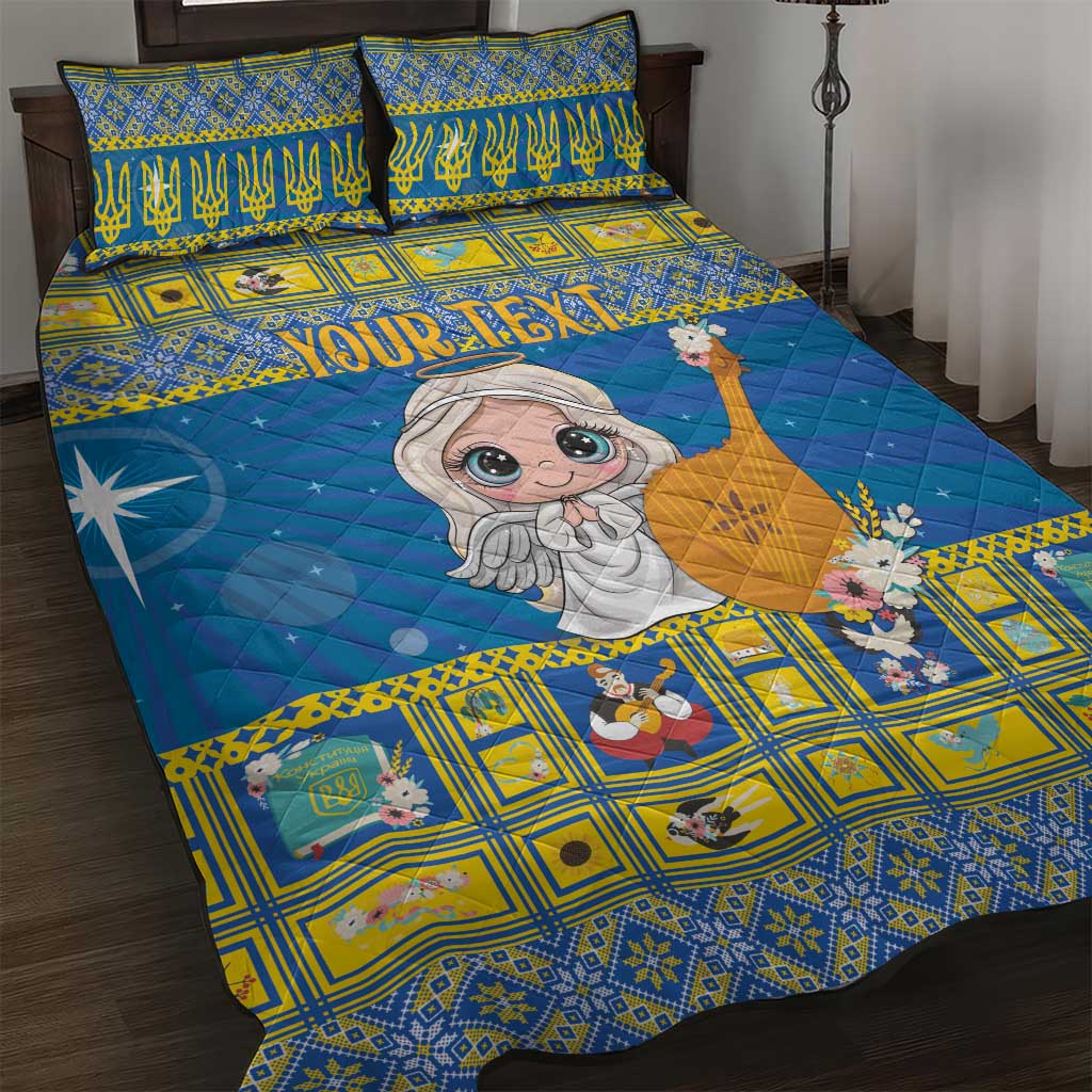 Blue and yellow quilt bed set with cartoon angel and star motifs, with matching pillowcases