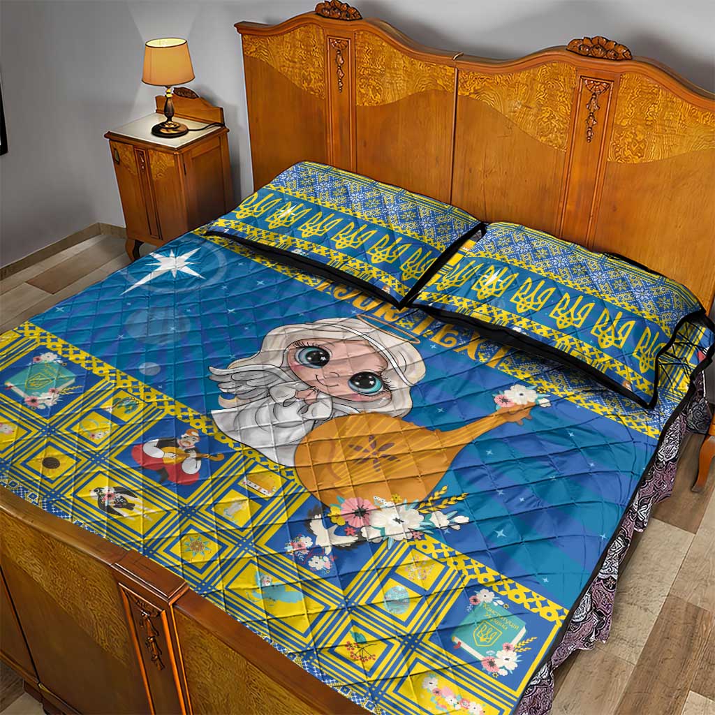 Blue and yellow quilt bed set with cartoon angel and festive star print, on bed with two pillows