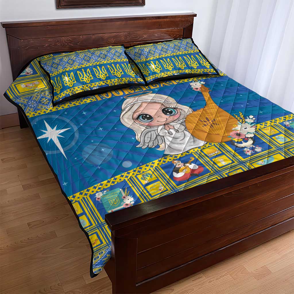 Blue and yellow quilt bed set with cartoon angel, geometric patchwork border, and two pillowcases