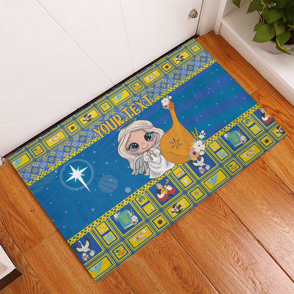 Personalized blue rubber doormat with angel holding harp and flowers, “YOUR TEXT”