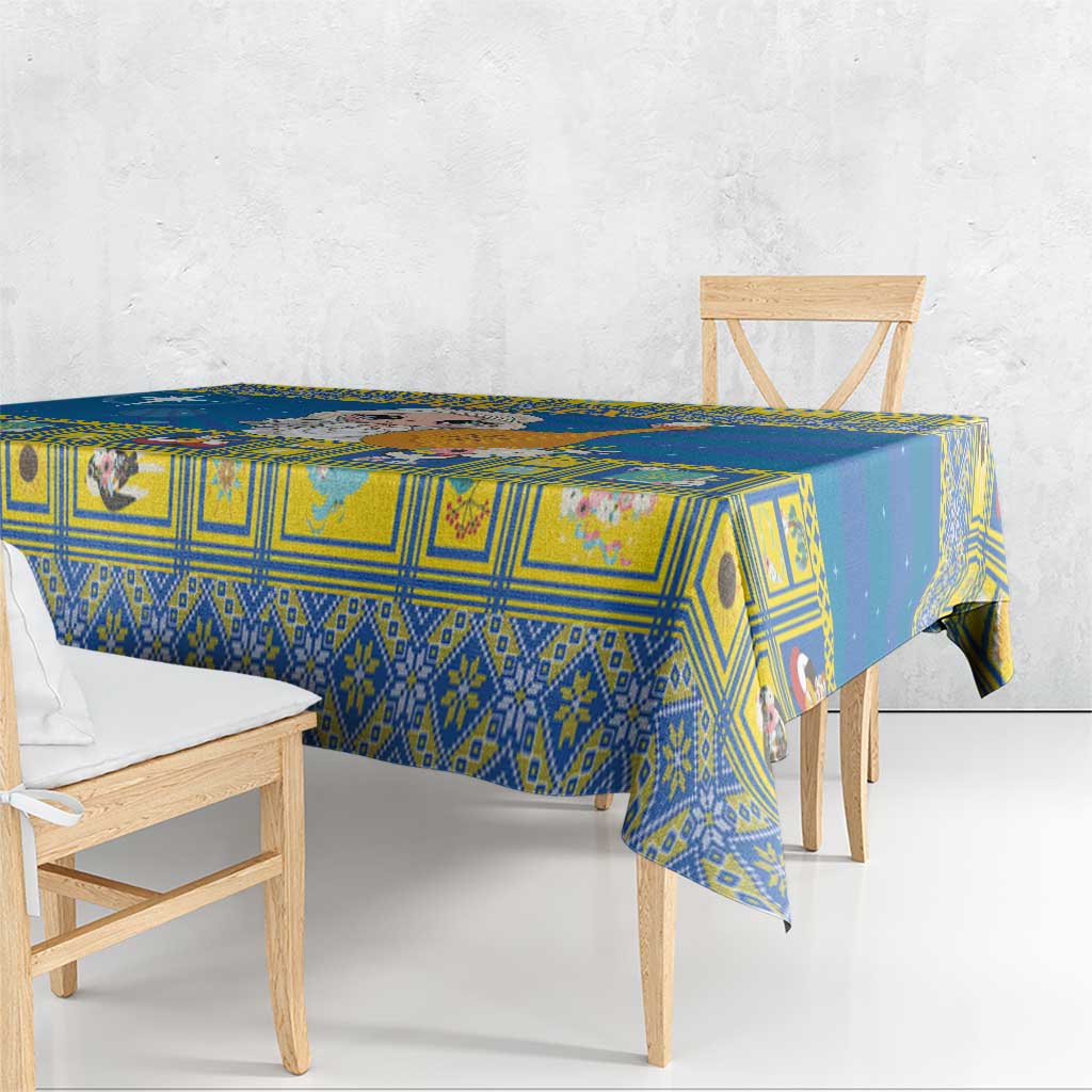 Blue Christmas tablecloth with geometric motif, draped over table edge