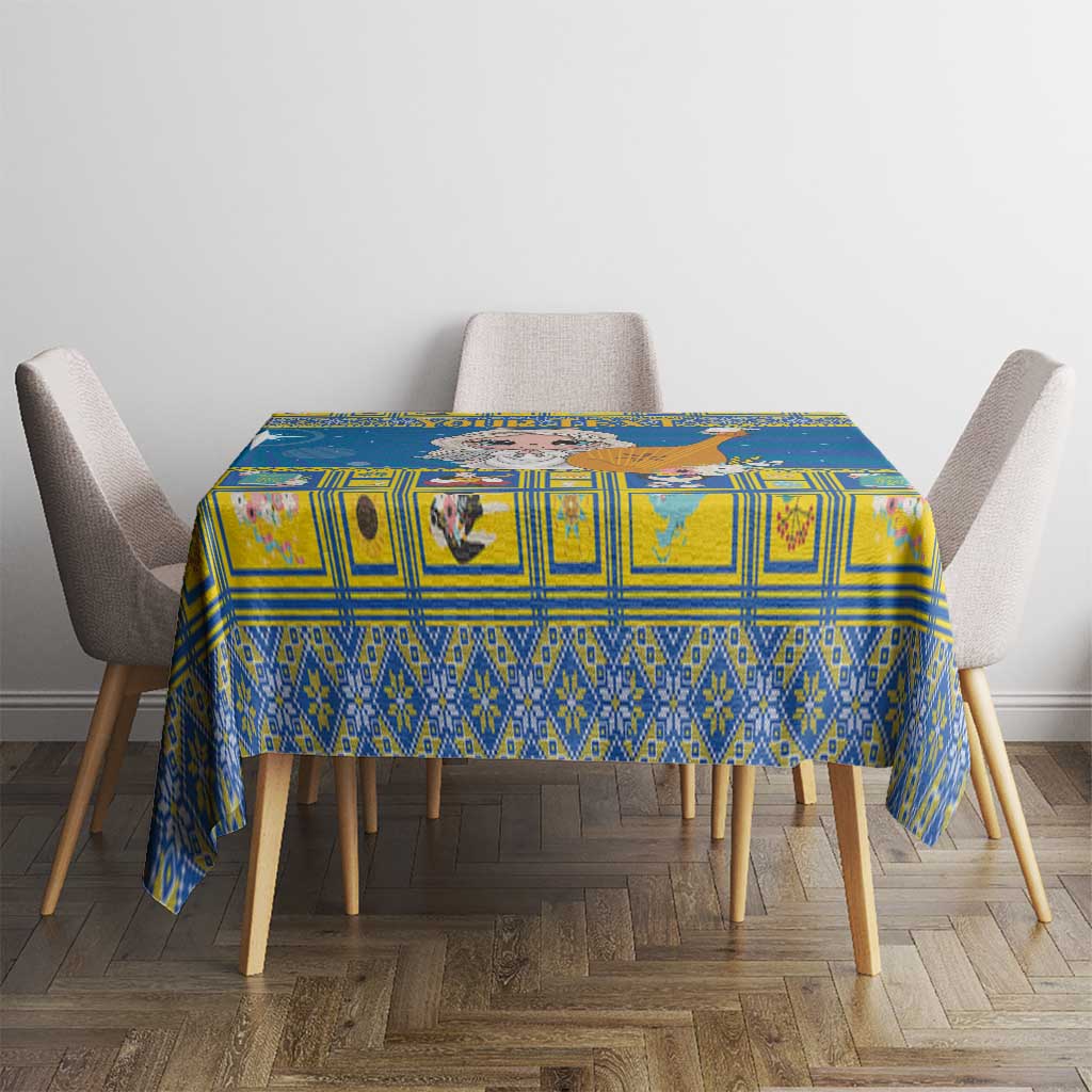 Blue Christmas tablecloth with geometric squares, on a dining table with chairs