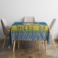 Blue Christmas tablecloth with geometric squares, on a dining table with chairs