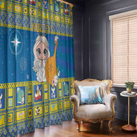Blue printed window curtains with angel figure holding a harp and hanging star motif