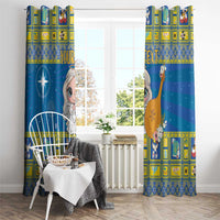 Blue window curtain panels showing angel face and star, with bright yellow grid border