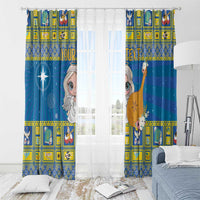Blue curtain panels with angel and star designs, yellow border and window view behind