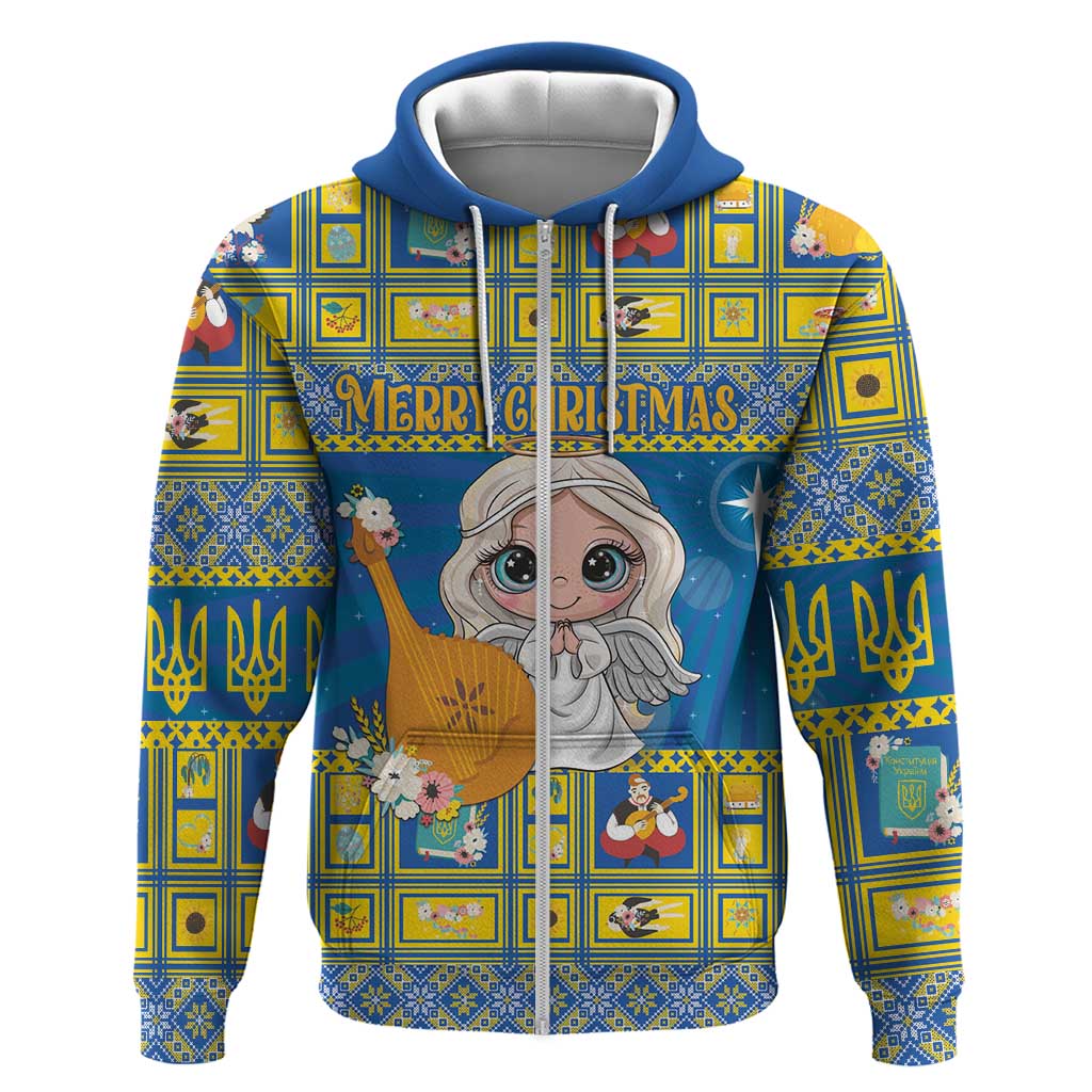 Blue zip hoodie with festive Christmas nativity cartoon graphic and decorative geometric pattern.