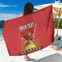 Red personalized sarong with lion crest, 1944 print, and customizable text