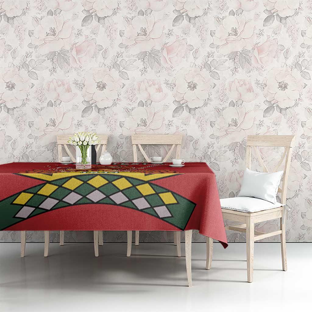 Red tablecloth with lion graphic and geometric banner design on dining table