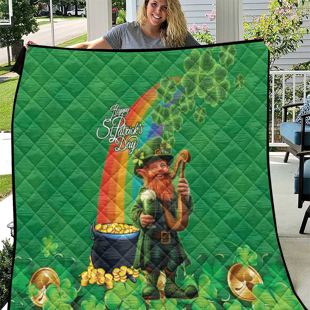 Green St. Patrick’s Day quilt showing leprechaun with harp and rainbow across shamrock pattern.
