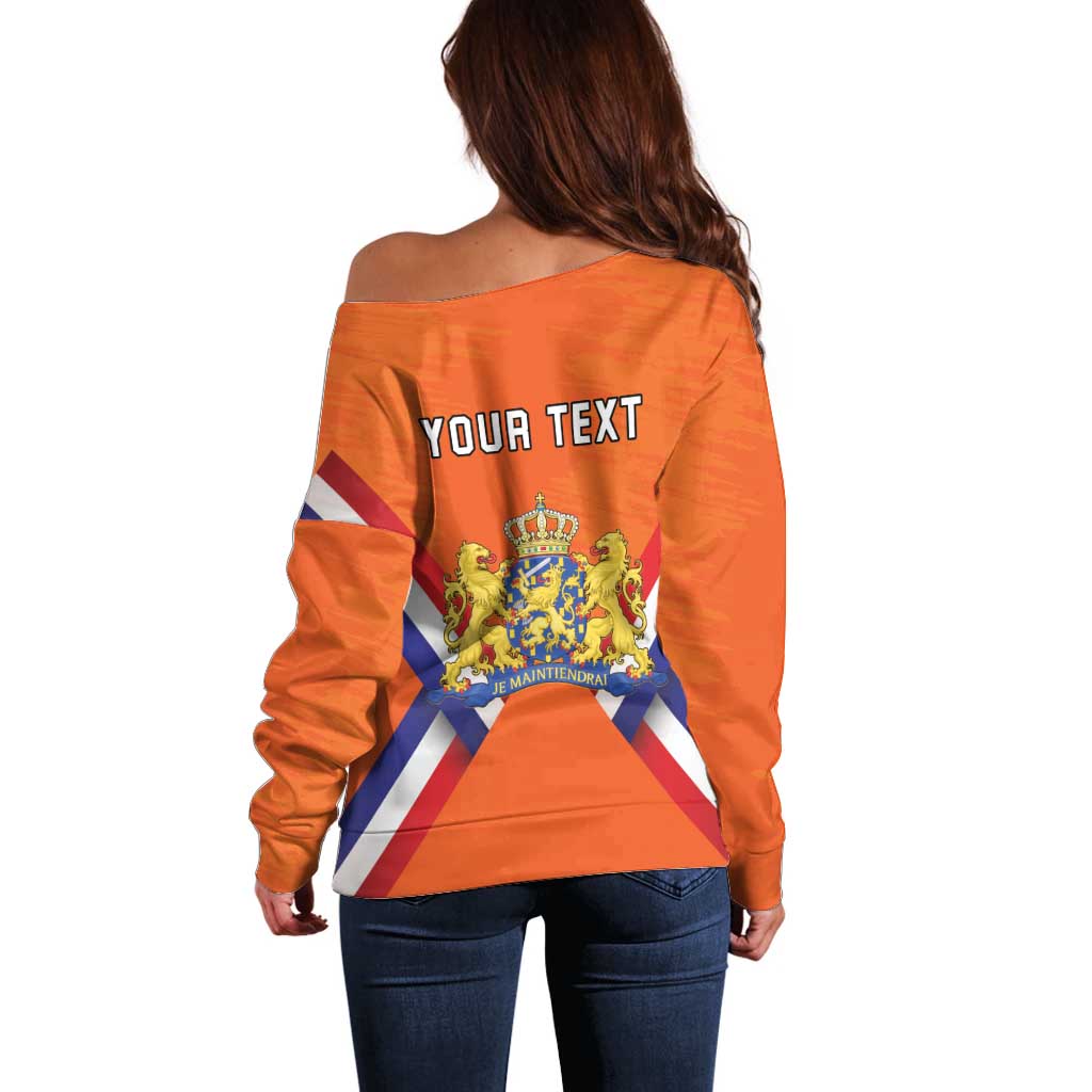 Women’s orange off-shoulder sweater with customizable text and lion-crown crest