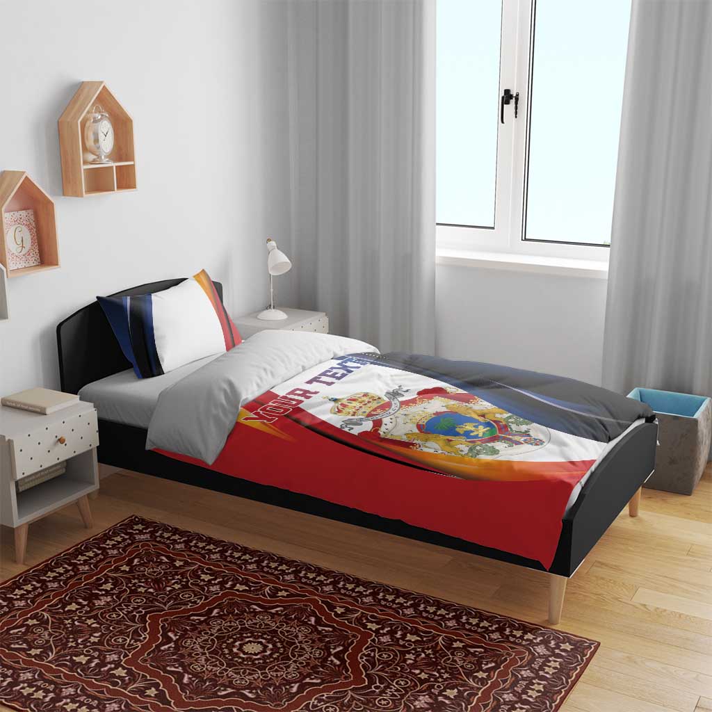 Personalized bedding set with duvet and pillowcases in red, blue, and white flag-style print