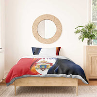 Personalized bedding set with red, blue, and white duvet cover with crest and 'YOUR TEXT'