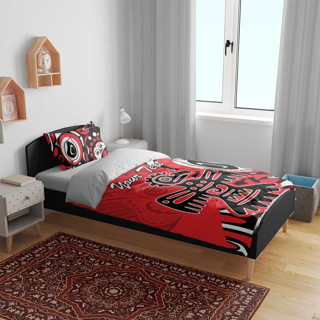 Red, black, and white tribal eagle bedding set on bed with two pillows