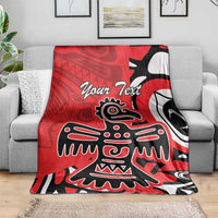 Red personalized blanket on gray couch, eagle totem graphic with "Your Text" center