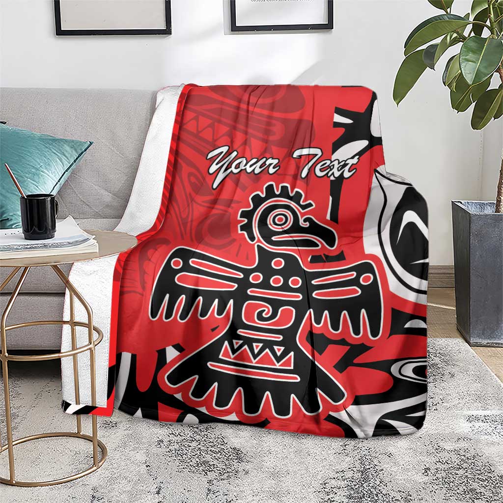 Red personalized throw blanket on chair with eagle totem graphic and "Your Text"