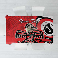 Red tablecloth with bold black, white, and gray eagle-style graphic design