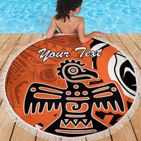 Orange round beach blanket with fringed edge and eagle print, "Your Text" centered