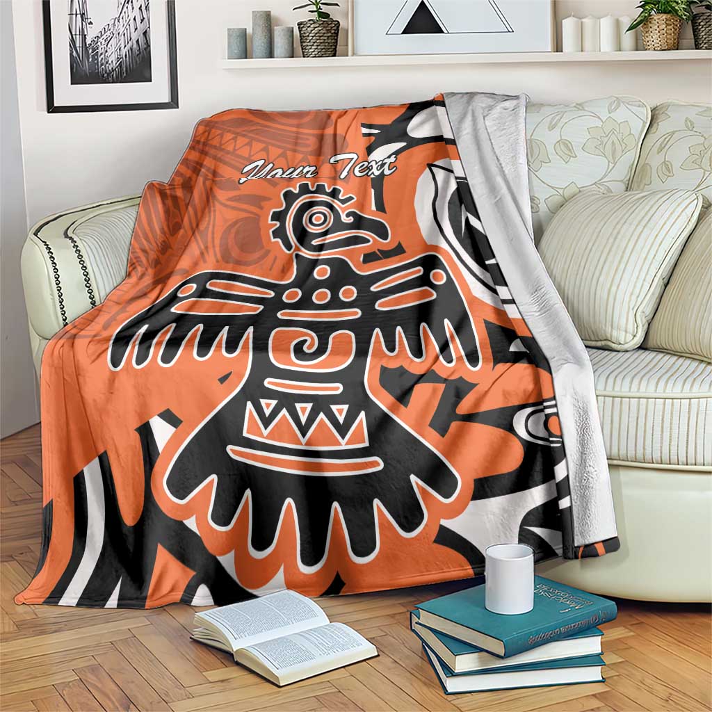Personalized orange Haida eagle blanket with large eagle graphic and “Your Text” on front