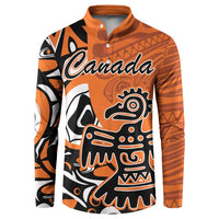 Orange button-up sweatshirt with Canada logo and Haida eagle graphic, long sleeves