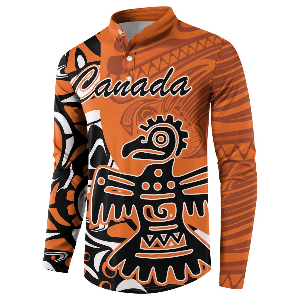Orange button-up sweatshirt with Canada logo and Haida eagle graphic, long sleeves