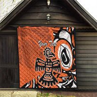 Orange quilt with Haida-style eagle graphic and “Your Text”, black and white on display
