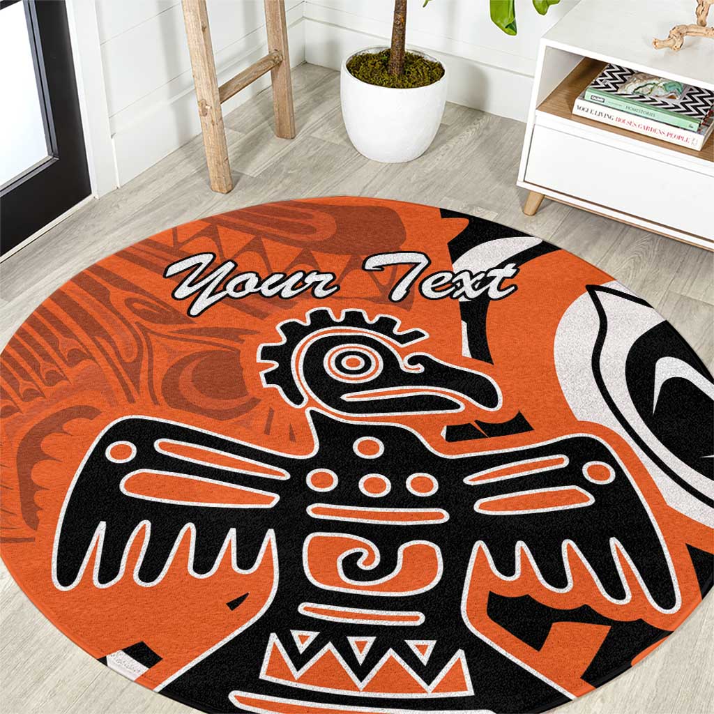 Orange round carpet with bold black-and-white eagle graphic, custom text area