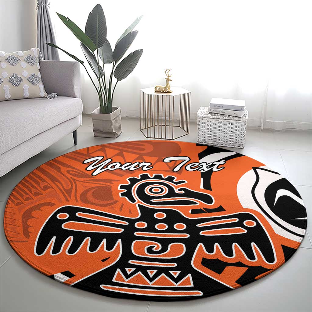 Orange round carpet with eagle tribal design and custom text in black script
