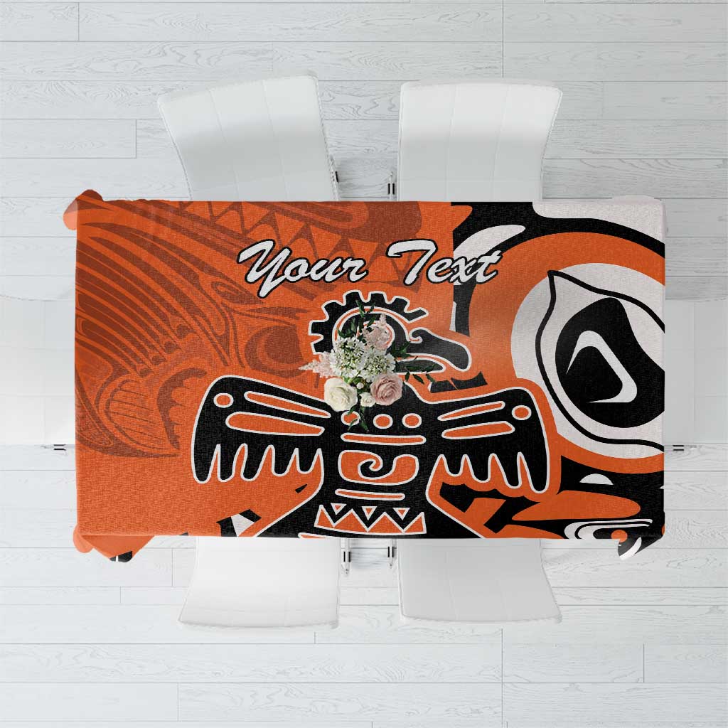 Orange, black, and white patterned tablecloth with custom text