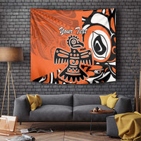 Orange Haida-style eagle tapestry with custom text and bold black-and-white figure artwork