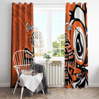 Orange and black-and-white Haida eagle curtains with personalized text details