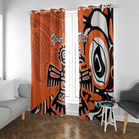 Orange window curtain set with Haida eagle design and bold black-and-white shapes