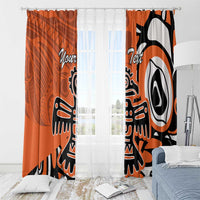 Orange curtains with eagle and Haida-style art, plus personalized text on panels