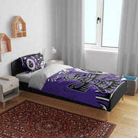 Purple duvet cover set on bed with pillowcases featuring eagle-style graphic and “Your Text”.