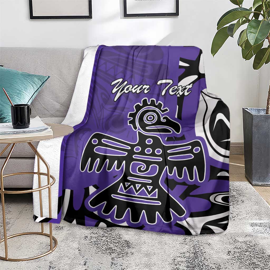 Purple blanket with 'Your Text' and eagle/Haida design over sofa backrest