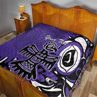 Purple quilt with custom text and Haida-style eagle graphic on a bedspread