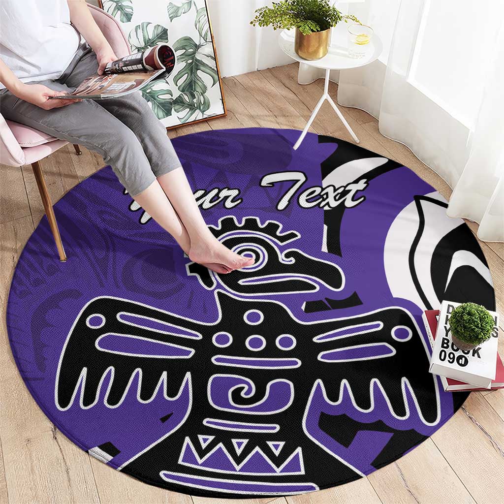 Round purple area rug with black and white eagle graphic, shown in living room