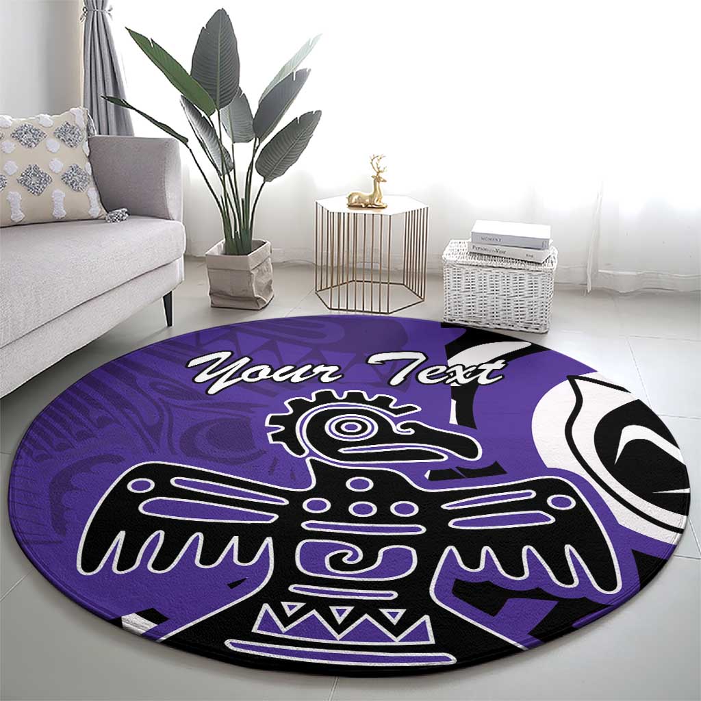 Round purple area rug with black-and-white eagle emblem, centered on floor