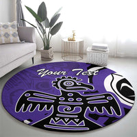 Round purple area rug with black-and-white eagle emblem, centered on floor