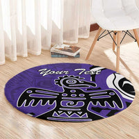 Round purple area rug with black-and-white eagle design, round shape on wood floor
