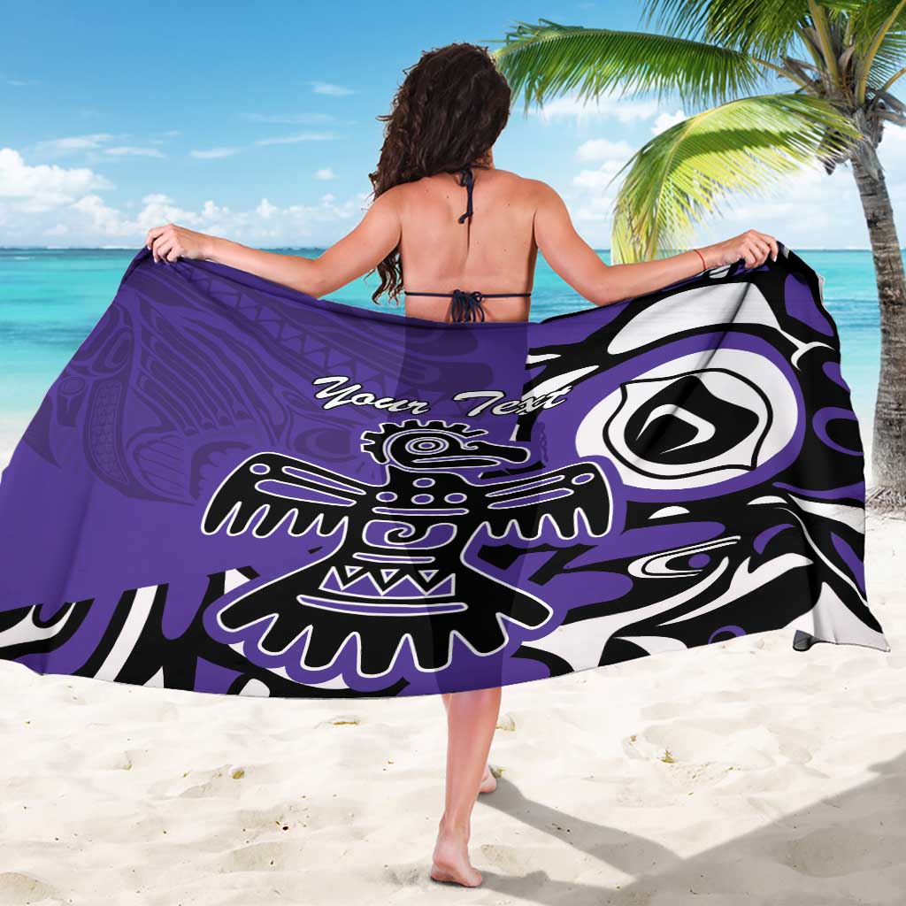 Purple sarong with Haida-style eagle print, black-and-white tribal detailing, tied at waist