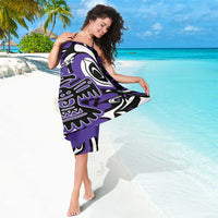 Purple sarong with large Haida eagle emblems and tribal linework in black and white