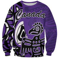 Purple crewneck sweatshirt with Canada wordmark and Haida-style eagle graphic