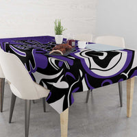 Purple tablecloth with abstract black-and-white tribal motif across the tabletop
