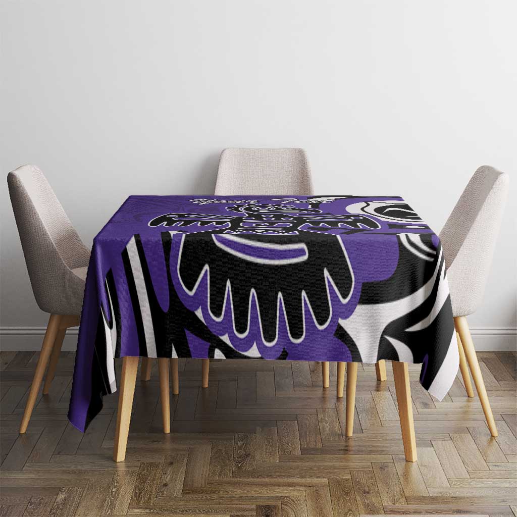 Purple tablecloth centered on a dining table with black-and-white tribal print