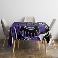 Purple tablecloth centered on a dining table with black-and-white tribal print