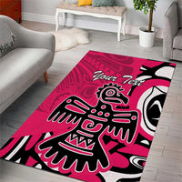 Pink area rug with black and white eagle motif and 'Your Text' script